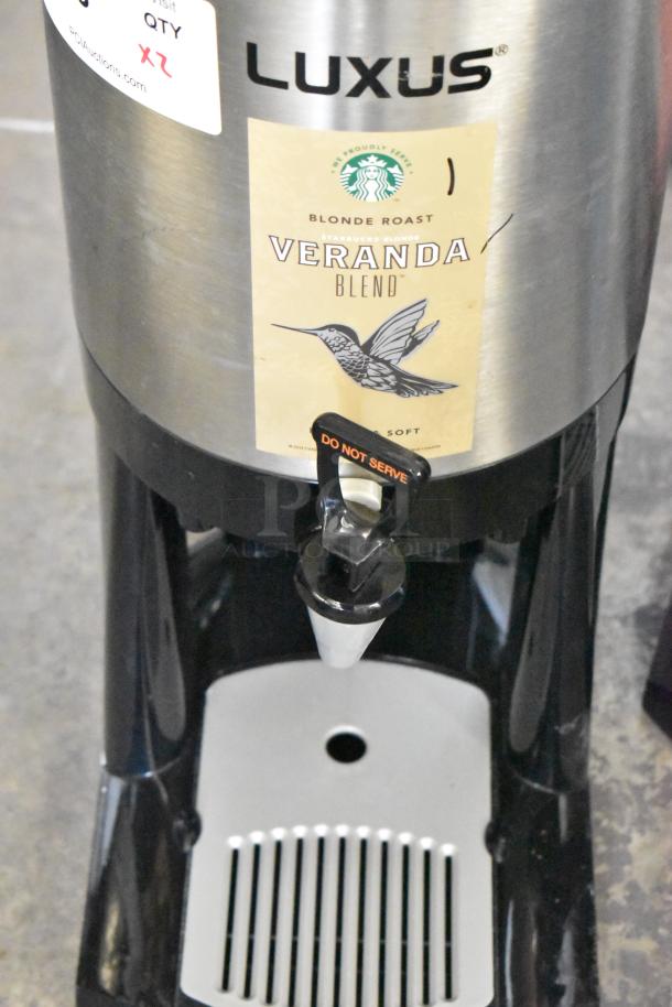 2 Fetco Luxus L3D-15 stainless steel beverage dispensers with drip tray. Starbucks Veranda Blend label. Excellent condition.