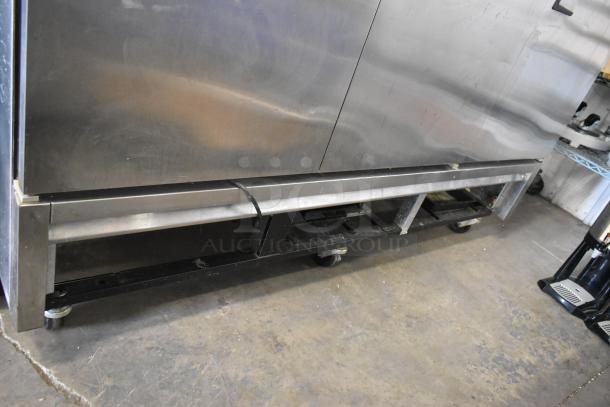 True T-72 stainless steel commercial 3-door freezer, poly-coated racks, on casters, 115V, 1 phase, in used condition.