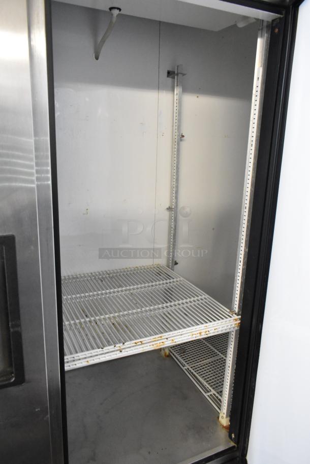 True T-72 stainless steel 3-door reach-in freezer, poly-coated racks, commercial casters, 115 volts, 1 phase.