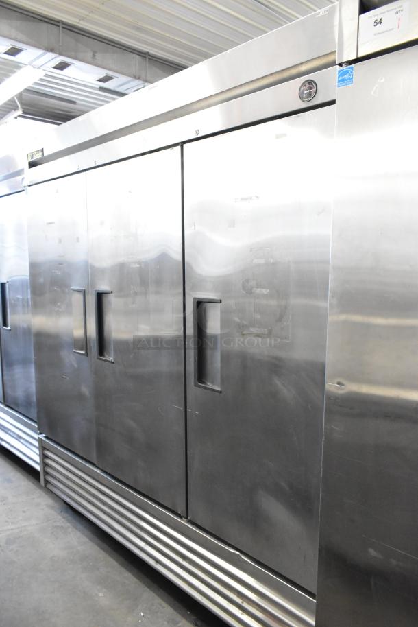 True T-72F stainless steel 3-door reach-in freezer with poly coated racks, on casters, 115V, 1-phase, commercial use.