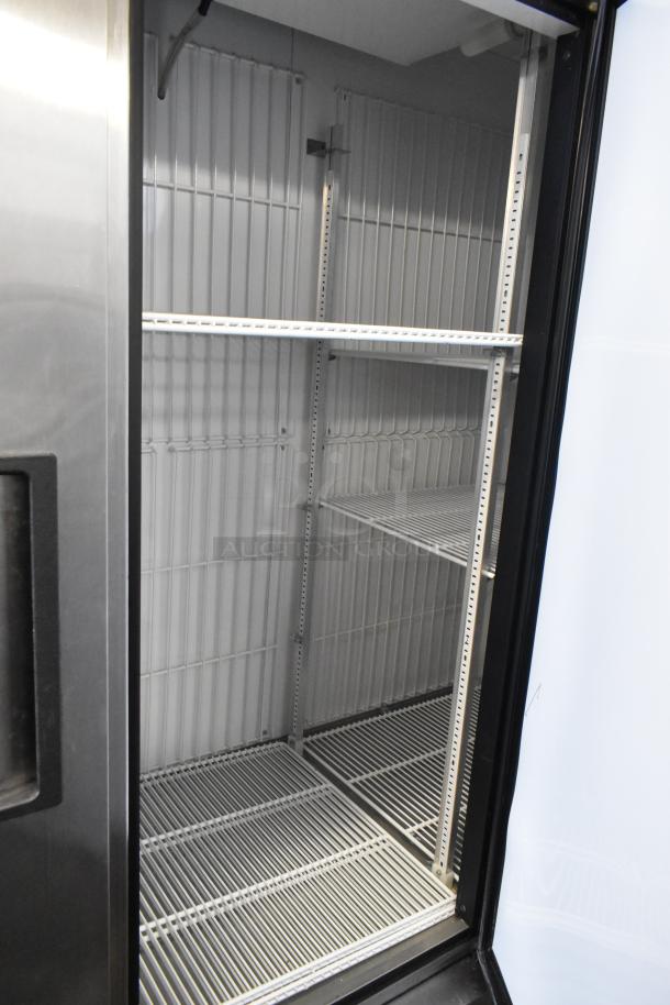 True T-72F stainless steel 3-door commercial freezer, with poly-coated racks and on casters. 115V, 1-phase.