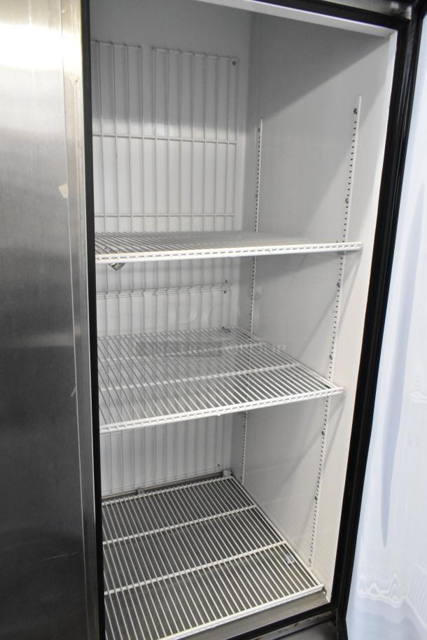 True T-72F stainless steel reach-in freezer. Three doors, poly-coated racks, on commercial casters. 115V, 1 phase. Clean interior.