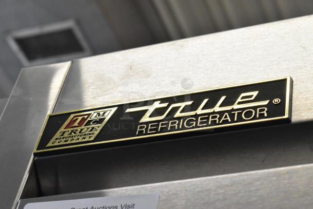 True T-72 stainless steel commercial cooler, 3 doors, poly-coated racks, on casters, 115V, 1 Phase, visible True logo.