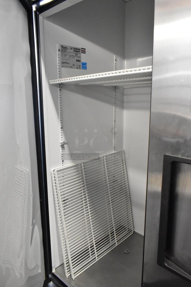 True T-72 commercial 3-door reach-in cooler, stainless steel, with poly-coated racks and commercial casters, 115 volts, 1 phase.