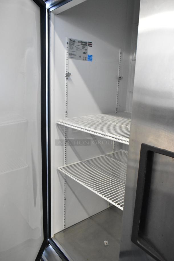 True T-72F stainless steel 3-door reach-in freezer, poly-coated racks, commercial casters, 115 volts, 1 phase.