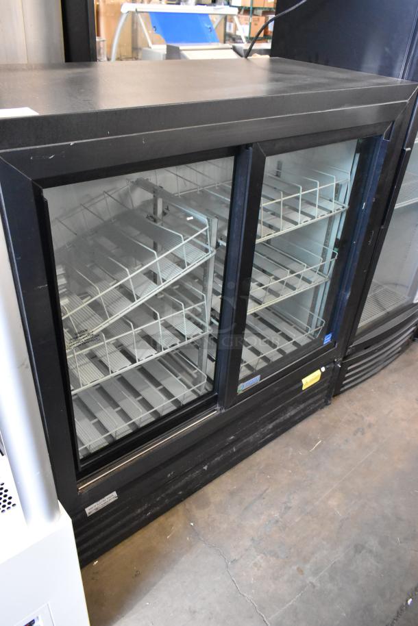 Imbera VRD41 metal commercial 2-door cooler merchandiser with poly coated racks, 115 volts, 1 phase, excellent condition.