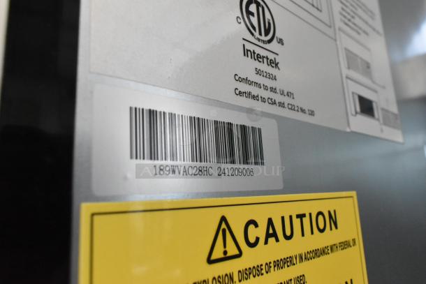 Barcode and caution labels on Avantco 189WVAC28HC refrigerated air curtain merchandiser.