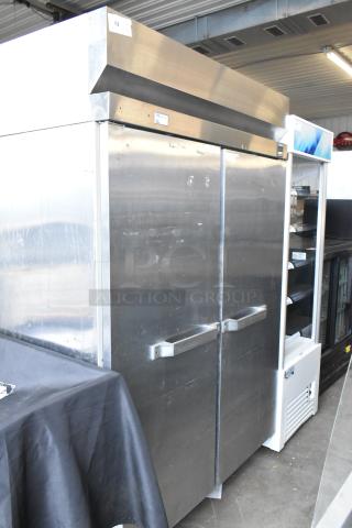 Hobart QF2 stainless steel commercial 2-door reach-in freezer, with racks, 120V, 1 phase. Some surface wear visible.
