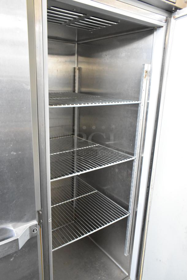 Hobart QF2 stainless steel commercial 2-door reach-in freezer with racks, 120 volts, 1 phase, open door view.