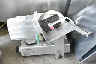 2022 Bizerba GSP H metal commercial meat slicer, 120V, 1 phase, excellent condition, with visible control knobs and product tray.