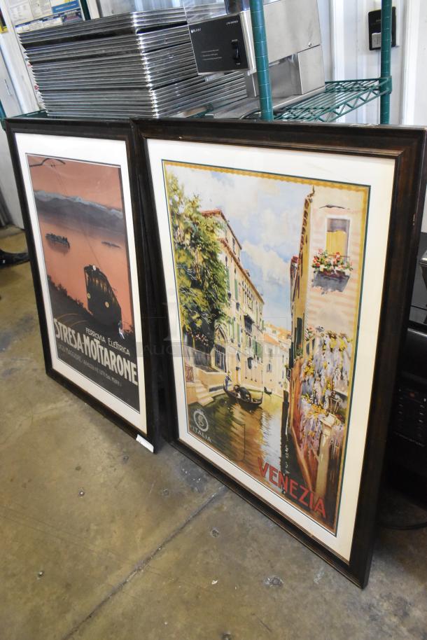 Two framed vintage-style posters featuring "Stresa-Mottarone" and "Venezia" themes in dark wooden frames.