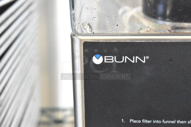2024 Bunn LPG stainless steel coffee bean grinder, countertop model. Features 120 volts, 1 phase power. Brand logo visible.