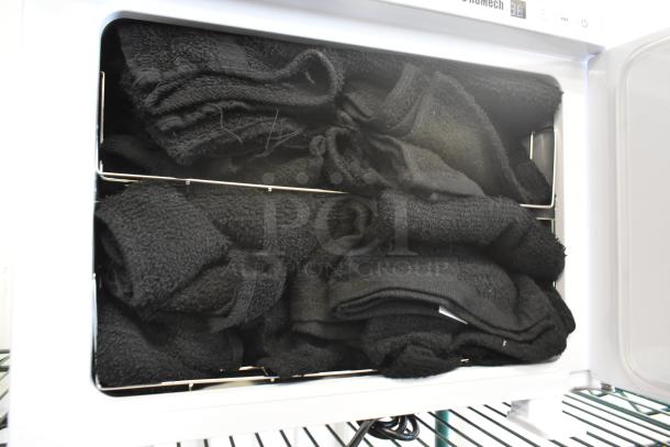 RoMech Countertop Towel Warmer, 110 Volts, 1 Phase, with black towels inside. Features compact design, energy-efficient heating.