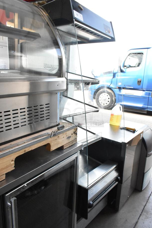 BKI HSS2-4T metal reach-in hot merchandiser on casters, 208V, 1 phase. Features multi-shelf design and good condition.