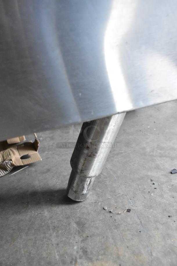 Close-up of Vulcan VSX24G steam cabinet leg in stainless steel. Condition appears used with some visible wear.