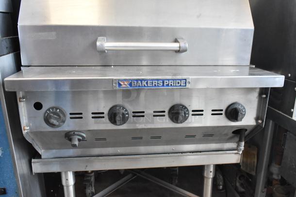 Bakers Pride CBBQ30S stainless steel commercial propane charbroiler grill with cover, knobs, and commercial casters.
