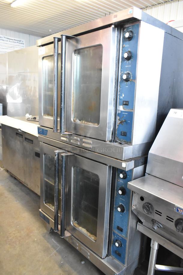 Duke stainless steel full-size convection ovens with view-through doors, metal racks, and thermostatic controls.