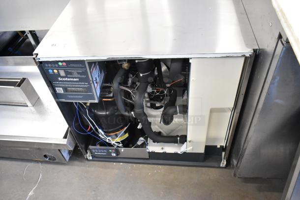 2024 Scotsman MC1030MA-32A stainless steel commercial ice head, 208/230V, 1 phase, with open front panel showing internal components.