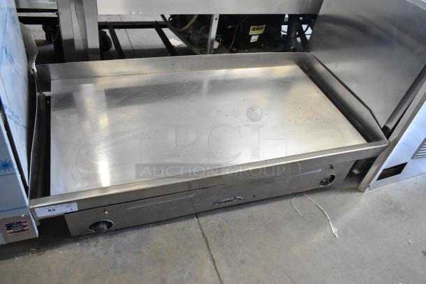 Star stainless steel commercial countertop flat top griddle, gently used. Features dual control knobs and spacious cooking surface.