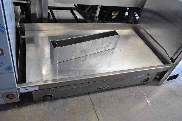 Star stainless steel commercial countertop flat top griddle, used, with control knobs and grease tray, minor surface wear.