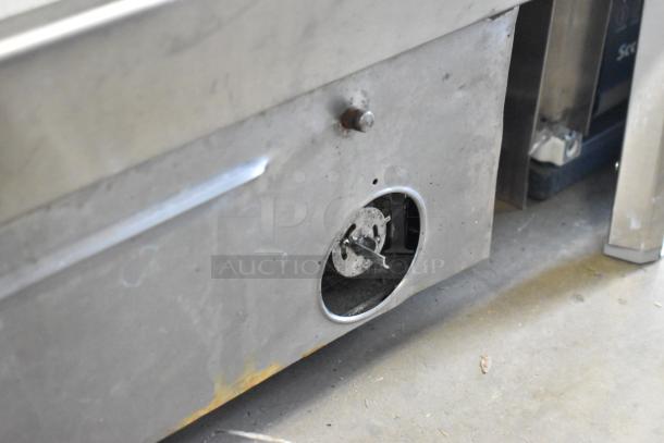 Star stainless steel commercial countertop flat top griddle. Visible wear on surface; round burner control exposed.