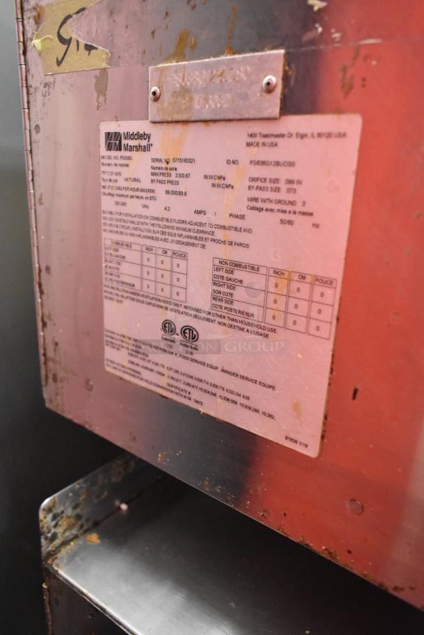 Middleby Marshall PS638G stainless steel commercial conveyor pizza oven with visible label detailing model, serial number, and specifications.