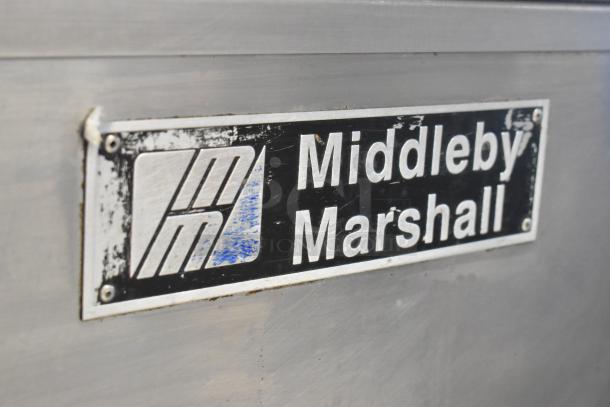 Middleby Marshall PS638G stainless steel label on commercial pizza oven, indicates brand and model.