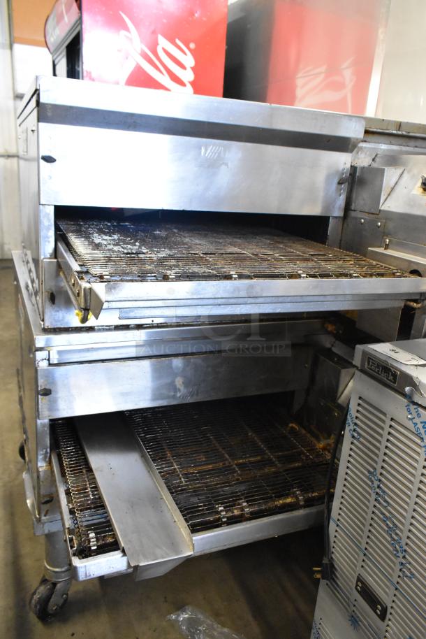 Middleby Marshall PS638G stainless steel conveyor pizza ovens on casters, natural gas, 89,000 BTU, 2021, used condition.