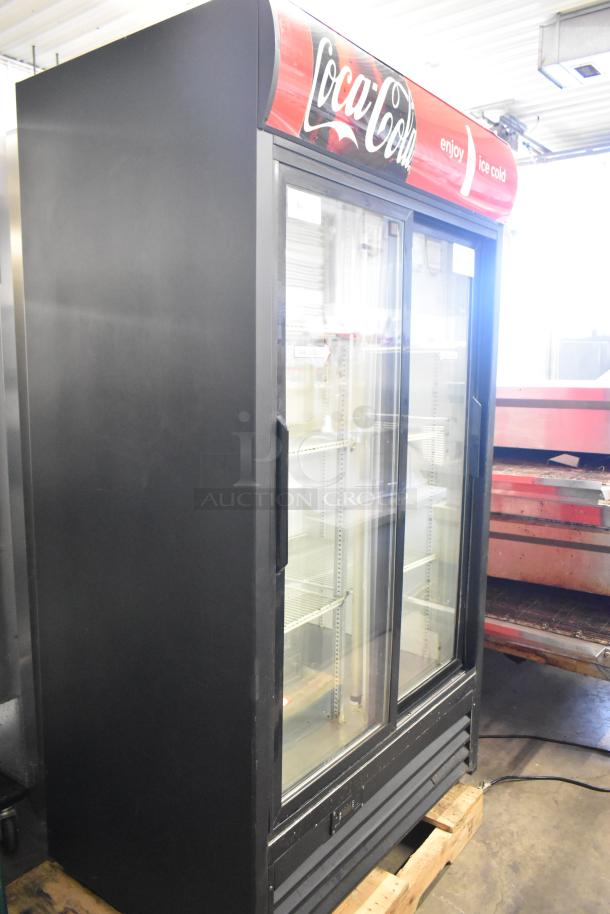 True GDM-37EM commercial cooler, metal, 2 glass doors, Coca-Cola branding, poly-coated racks, 115V, good condition.