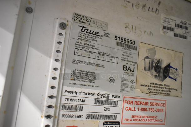True GDM-37EM cooler label showing model, serial number, 115 volts, 1 phase. Branding and service info visible.