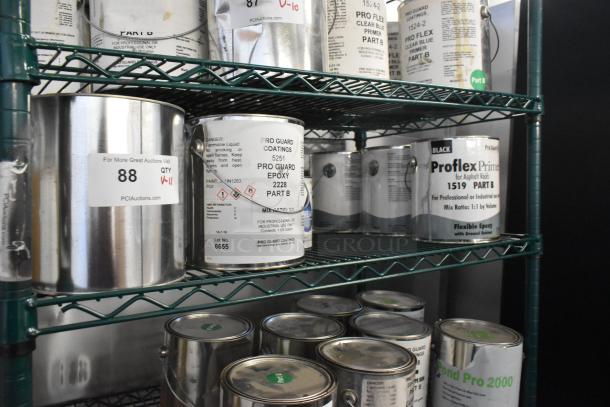 11 Pro Guard chemical cans including Proflex Primer for asphalt roofs and WR Enamel Red, on metal shelves, labeled for auction.