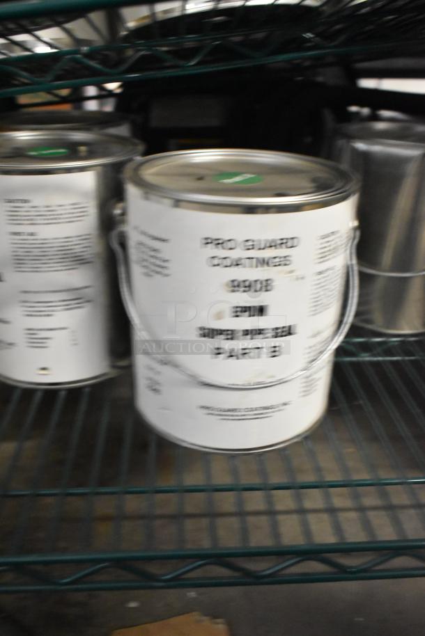 9 cans of Pro Guard chemicals, including 9908 Super Pipe Seal Part B. Cans have original labels and handles, stored on shelf.