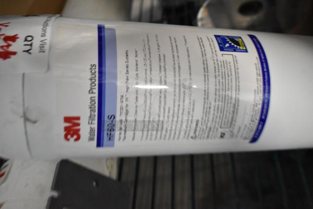 3M water filter cartridge, HF30-S model, labeled "Water Filtration Products," white cylinder, visible text details.
