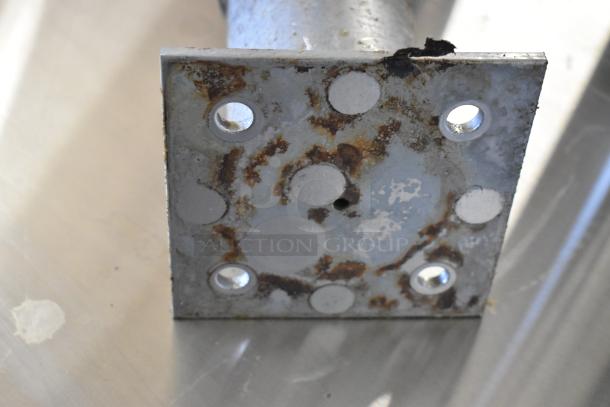 Lot of 4 commercial casters with rust on metal plate, showing signs of wear. Suitable for heavy-duty applications.