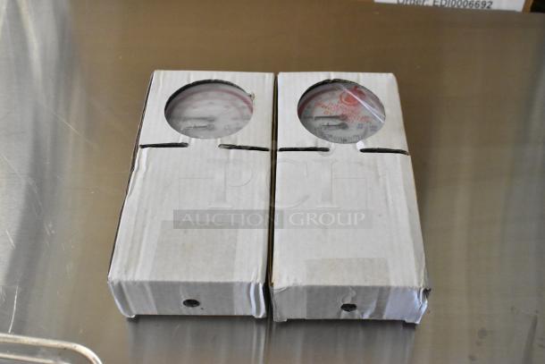 Two boxed Hatco dials with visible gauges, new condition; part of a six-item auction lot bid.
