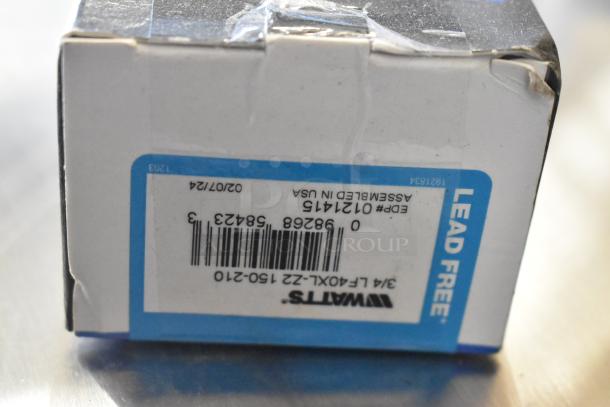 Watts 3/4 LFN250B-Z-020 iron body water pressure regulator box, showcasing barcodes and "Lead Free" label.