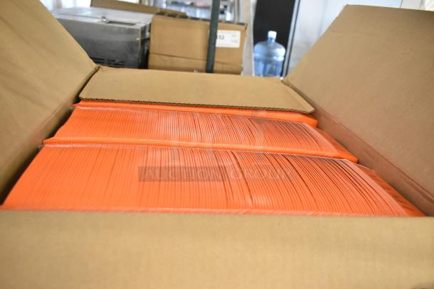 Box of Sysco clamshell fries containers, brand new, bright orange, neatly stacked in an open cardboard box.