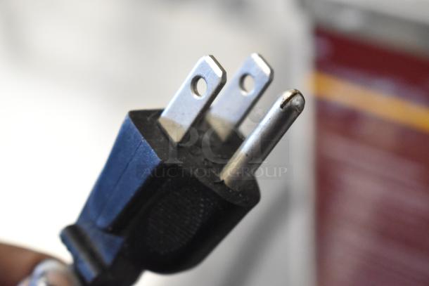 Close-up image of a three-prong electrical plug for Nemco 6135-SUB countertop food warmer, 120 volts, 1 phase.