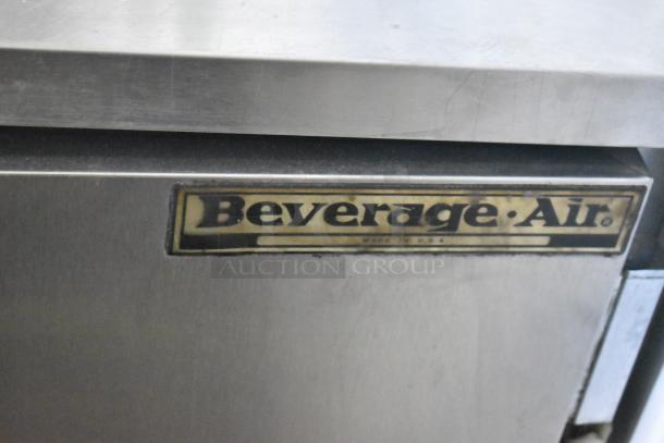 Beverage Air SP48-08 stainless steel prep table with Bain Marie top. Includes commercial casters. Model label visible.