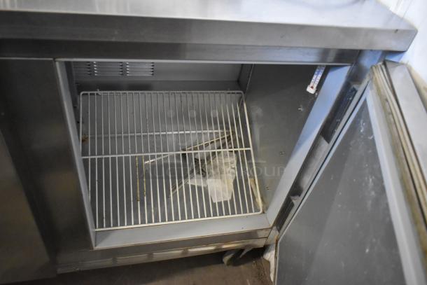 Beverage Air SP48-08 stainless steel prep table with open cooler section, wire shelves, on commercial casters. 115V, 1 phase.