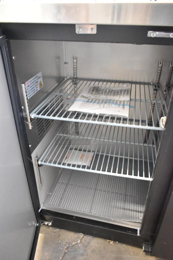 Brand new Avantco 178UDD72HC kegerator interior with wire shelves. Capacity: three 1/2 kegs. 115 volts, 1 phase.