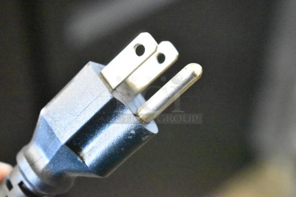 Close-up of a three-prong electrical plug for the Avantco 178UDD72HC kegerator beer dispenser, showing its sturdy construction.