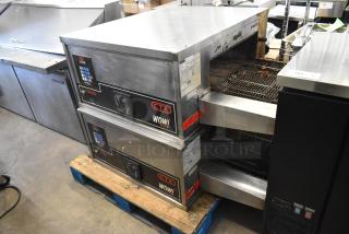 Two 2021 Middleby Marshall DZ33I stainless steel conveyor pizza ovens, electric-powered, on commercial casters.