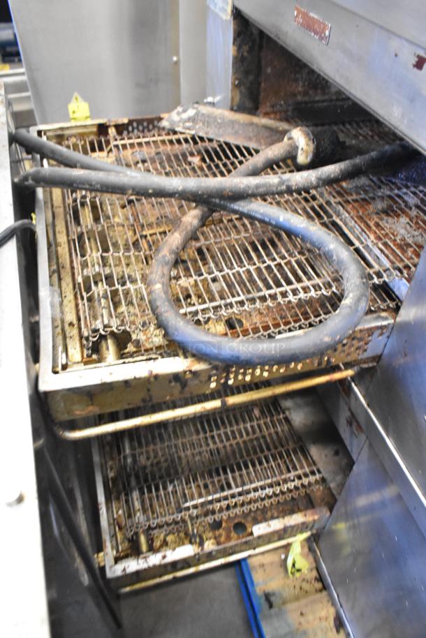 2 Middleby Marshall DZ33I Stainless Steel Conveyor Pizza Ovens on casters, used condition, 208V, 3/1 phase, visible wires.