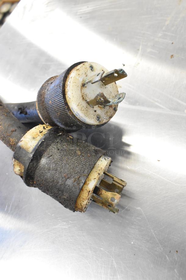 Close-up of worn power plugs for a 2021 Middleby Marshall CTX DZ33I commercial electric pizza oven.