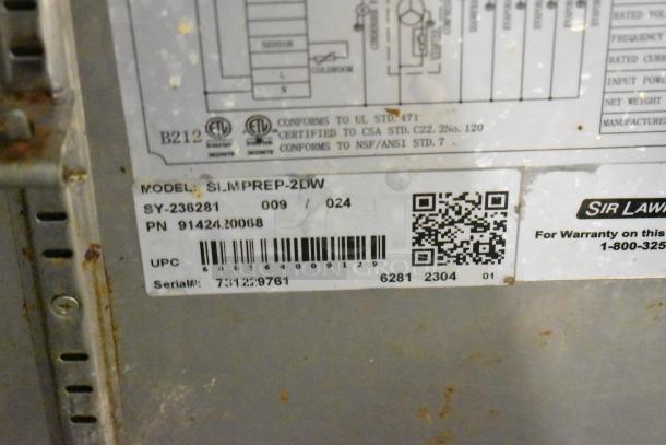 2023 Sir Lawrence SLMPREP-2DW stainless steel prep table with visible model, barcode, and certification labels.