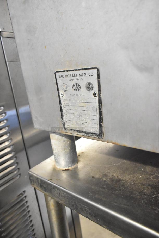 Hobart 4732 commercial meat grinder, metal, 208V, 3-phase. Features visible model tag, used condition.