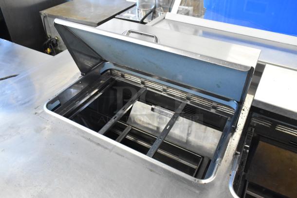 Delfield UCD4464N-12-DD5 stainless steel prep table with 4 drawers, missing one lid, 115 volts, 1 phase.