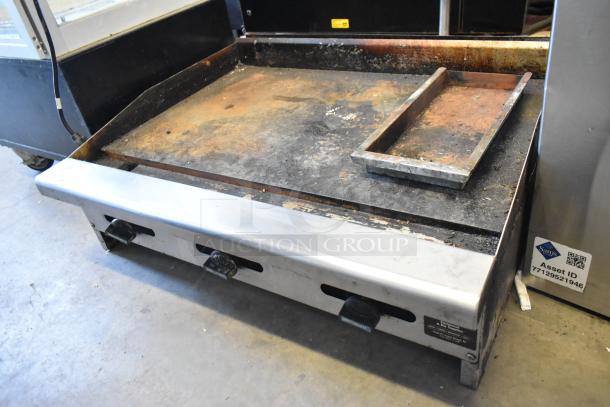 Radiance stainless steel commercial countertop flat top griddle, natural gas powered, used condition, visible surface wear.