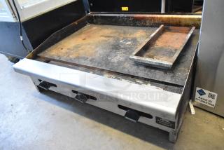 Radiance stainless steel commercial countertop flat top griddle, natural gas powered, used condition, visible surface wear.